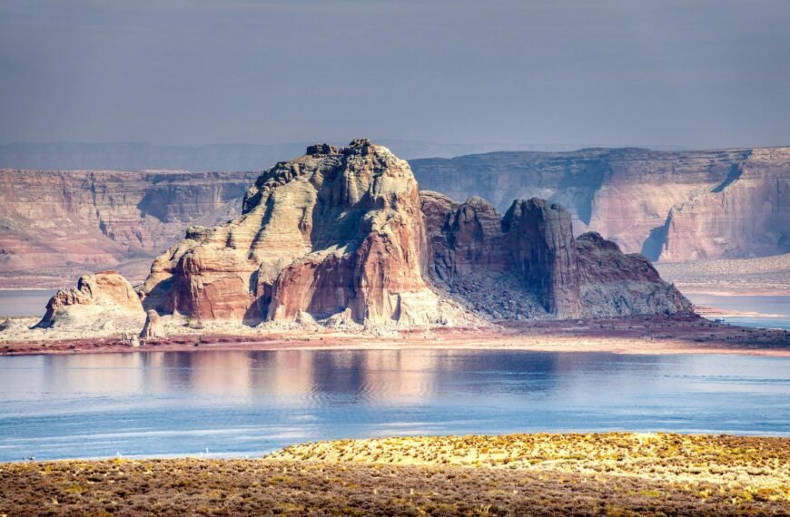 Low water levels at Lake Powell showing the reservoir's exposed shoreline and declining supply.